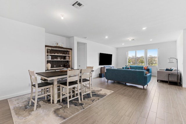 1218 Timber Reap Trl, The Acreage, FL 33470 - dining space featuring baseboards, wood finished floors, visible vents, and recessed lighting