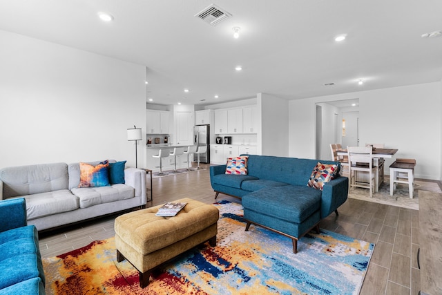 1218 Timber Reap Trl, The Acreage, FL 33470 - living room with visible vents, recessed lighting, and wood tiled floor