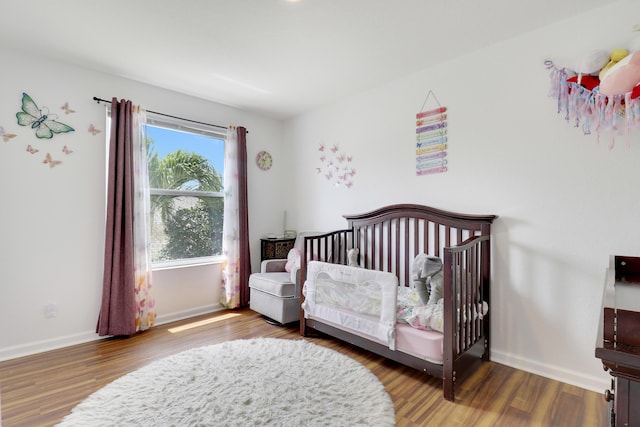 144 Pennock Landing Cir, Jupiter, FL 33458 - bedroom featuring wood finished floors and baseboards
