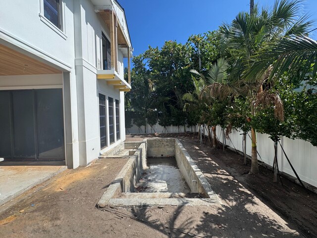 716 NE 2nd St, Delray Beach, FL 33444 - fenced backyard featuring a balcony