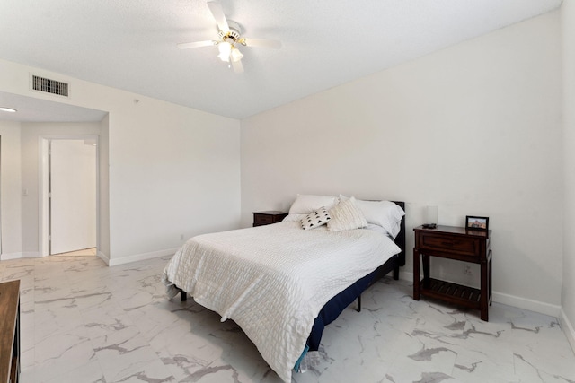 bedroom featuring visible vents, marble finish floor, baseboards, and ceiling fan