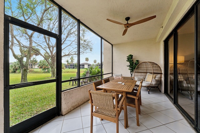 sunroom with a ceiling fan