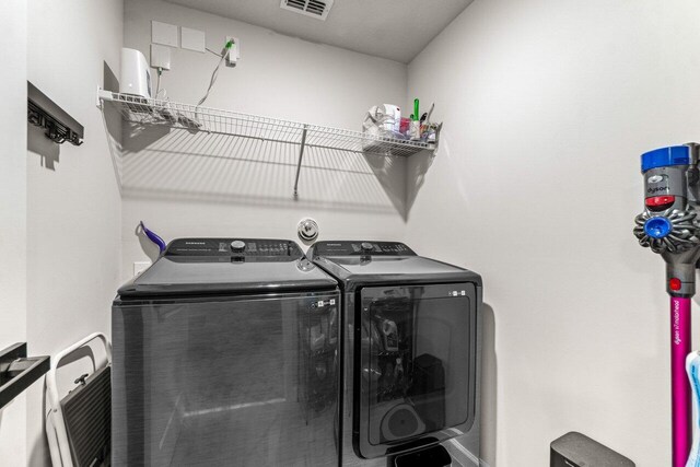 5612 Mentmore Dr, West Palm Beach, FL 33407 - laundry area with washer and clothes dryer