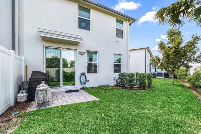 5612 Mentmore Dr, West Palm Beach, FL 33407 - back of house with stucco siding and a patio area
