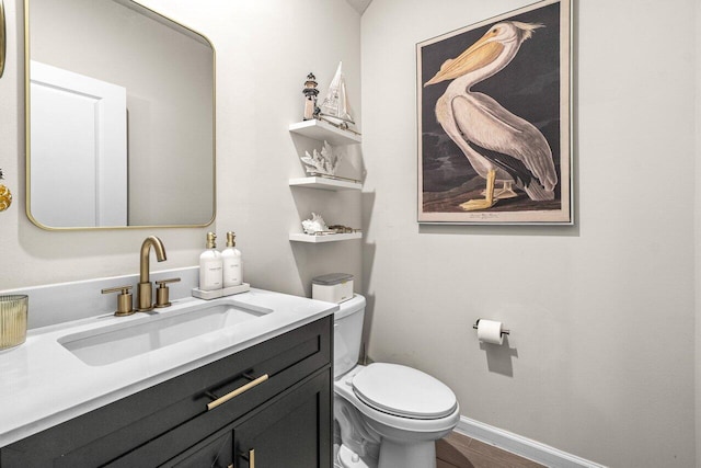 5612 Mentmore Dr, West Palm Beach, FL 33407 - half bath with toilet, baseboards, and vanity