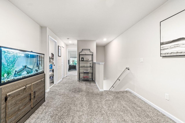 5612 Mentmore Dr, West Palm Beach, FL 33407 - hall with an upstairs landing, carpet, and baseboards