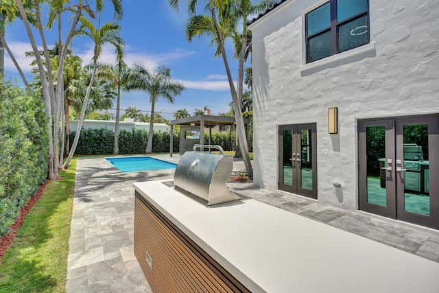 5832 Alton Rd, Miami Beach, FL 33140 - outdoor pool with a patio, french doors, a fenced backyard, and a grill
