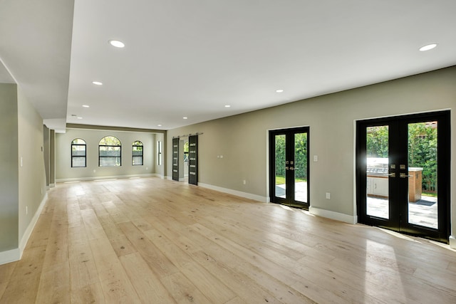 5832 Alton Rd, Miami Beach, FL 33140 - unfurnished living room with french doors, a healthy amount of sunlight, and recessed lighting
