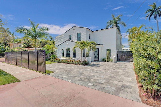 5832 Alton Rd, Miami Beach, FL 33140 - mediterranean / spanish house featuring stucco siding and fence