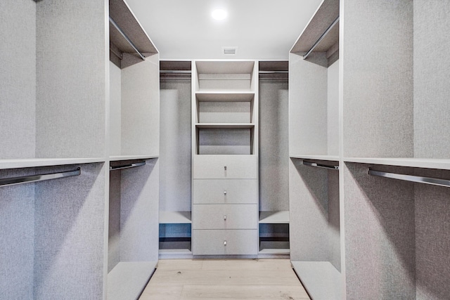 5832 Alton Rd, Miami Beach, FL 33140 - walk in closet with visible vents and wood finished floors