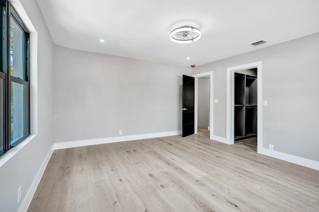 5832 Alton Rd, Miami Beach, FL 33140 - unfurnished bedroom with recessed lighting, light wood-type flooring, visible vents, baseboards, and a spacious closet