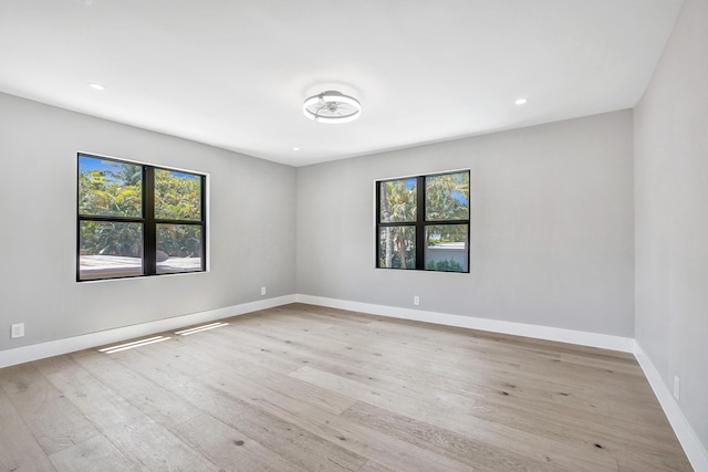 5832 Alton Rd, Miami Beach, FL 33140 - spare room with baseboards, recessed lighting, light wood-style floors, and plenty of natural light