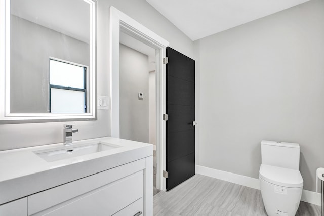 5832 Alton Rd, Miami Beach, FL 33140 - bathroom with baseboards, toilet, and vanity