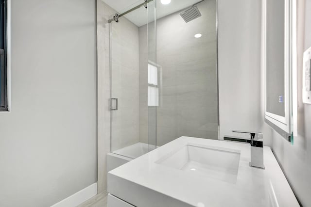 5832 Alton Rd, Miami Beach, FL 33140 - bathroom featuring visible vents, a shower stall, and vanity