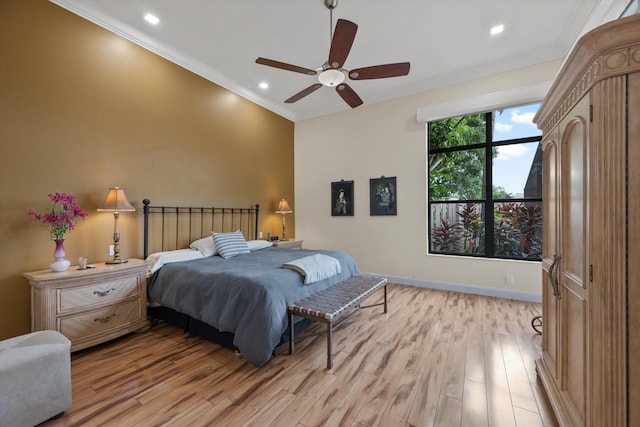 bedroom with light wood-style floors, crown molding, a ceiling fan, and recessed lighting
