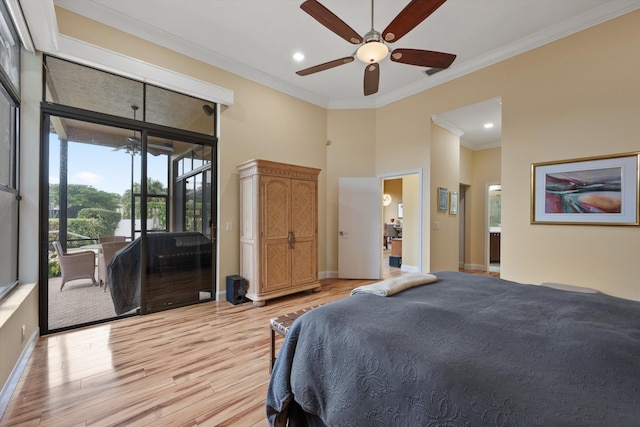 bedroom with a high ceiling, light wood-style flooring, access to outside, and ornamental molding