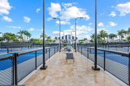 view of sport court featuring fence
