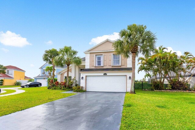 12820 Smithdale Pl, Boca Raton, FL 33428 - view of front of house with driveway, a garage, stucco siding, and a front yard