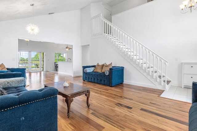12820 Smithdale Pl, Boca Raton, FL 33428 - living room with wood finished floors, a high ceiling, baseboards, and stairway