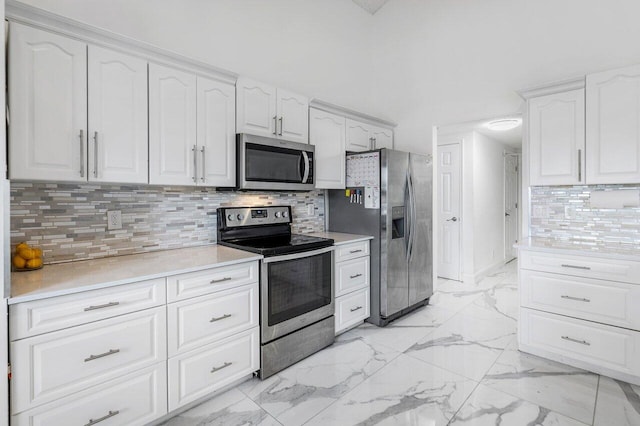 12820 Smithdale Pl, Boca Raton, FL 33428 - kitchen featuring decorative backsplash, marble finish floor, white cabinets, and stainless steel appliances