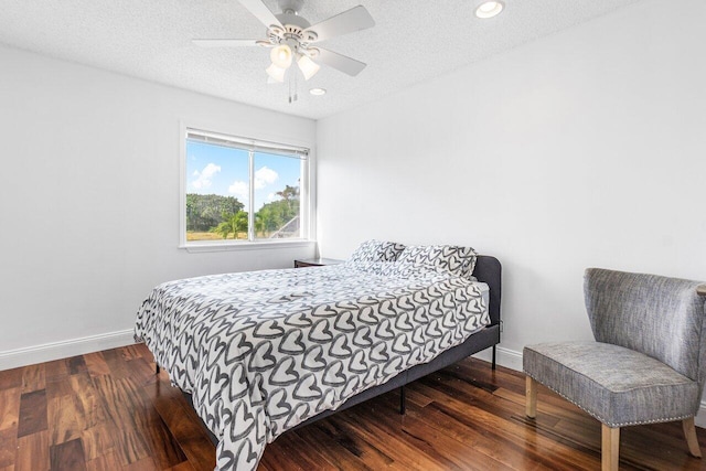 12820 Smithdale Pl, Boca Raton, FL 33428 - bedroom featuring ceiling fan, a textured ceiling, recessed lighting, dark wood-style flooring, and baseboards