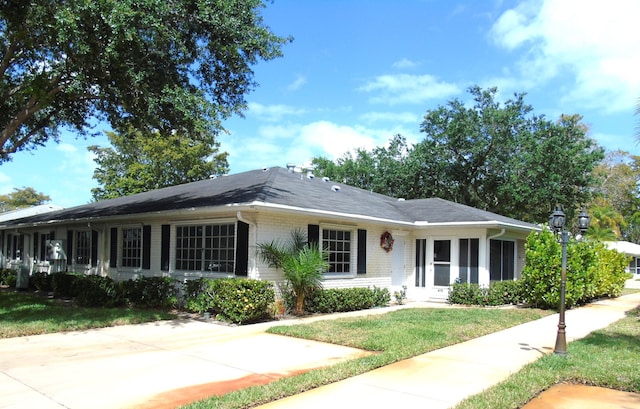 10132 45th Way S Unit 470, Boynton Beach, FL 33436 - ranch-style house with brick siding and a front yard