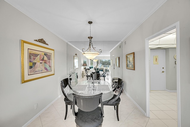 701 E Camino Real Unit 4B, Boca Raton, FL 33432 - dining space with ornamental molding, baseboards, and light tile patterned floors