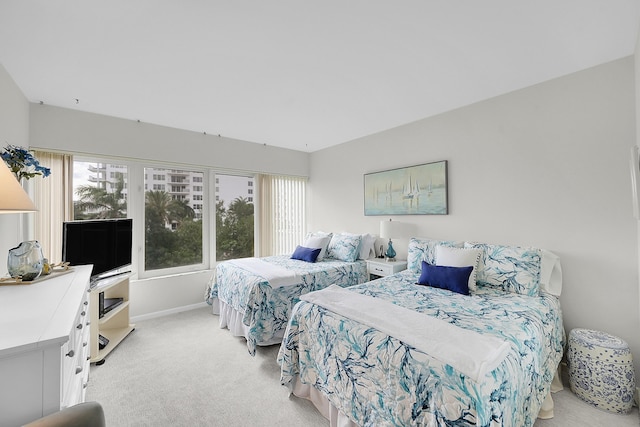 701 E Camino Real Unit 4B, Boca Raton, FL 33432 - bedroom featuring light carpet and baseboards