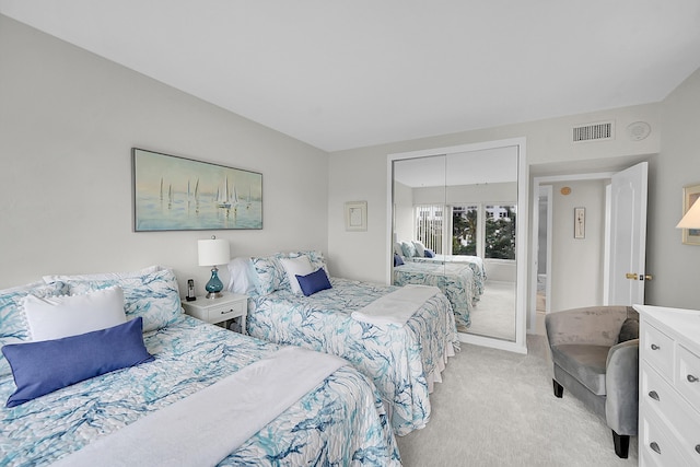 701 E Camino Real Unit 4B, Boca Raton, FL 33432 - bedroom with light carpet and a closet