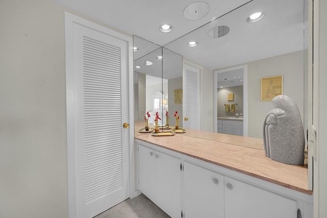 701 E Camino Real Unit 4B, Boca Raton, FL 33432 - bathroom with recessed lighting and vanity