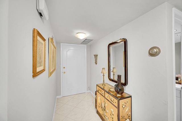701 E Camino Real Unit 4B, Boca Raton, FL 33432 - hallway featuring light tile patterned floors and baseboards