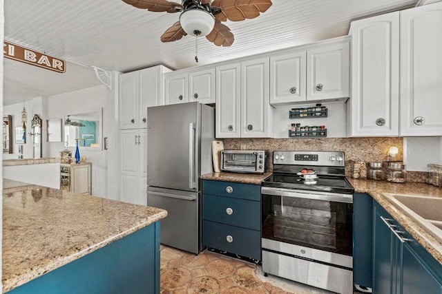 kitchen with stainless steel appliances, ceiling fan, blue cabinets, and white cabinetry