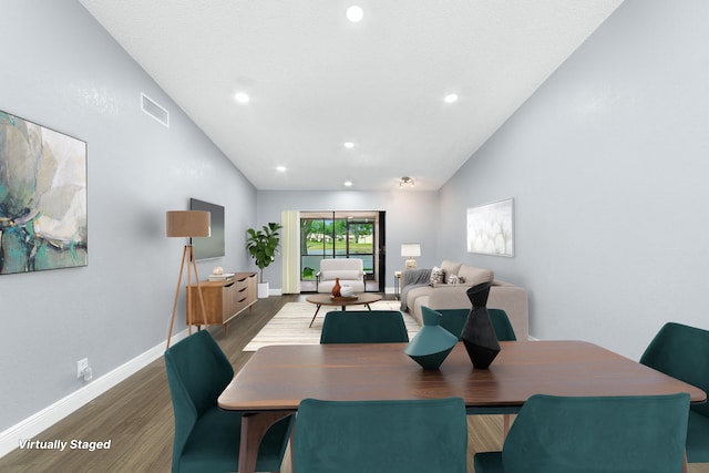 dining room with vaulted ceiling, visible vents, recessed lighting, wood finished floors, and baseboards
