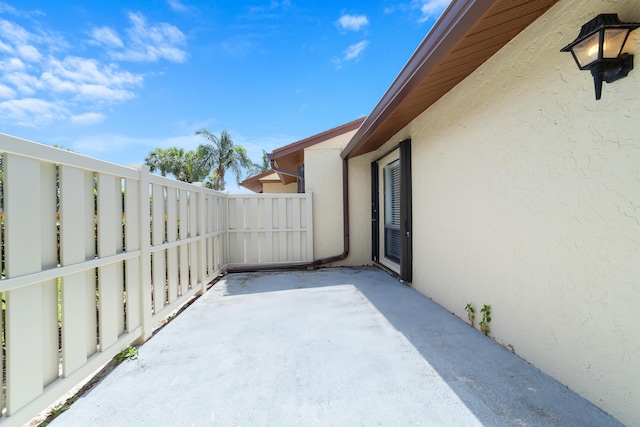 view of patio / terrace featuring fence