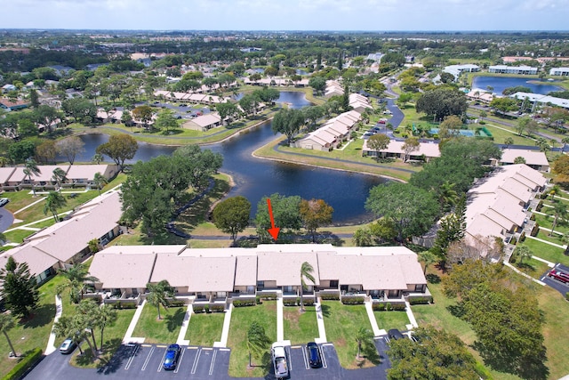 drone / aerial view featuring a residential view and a water view