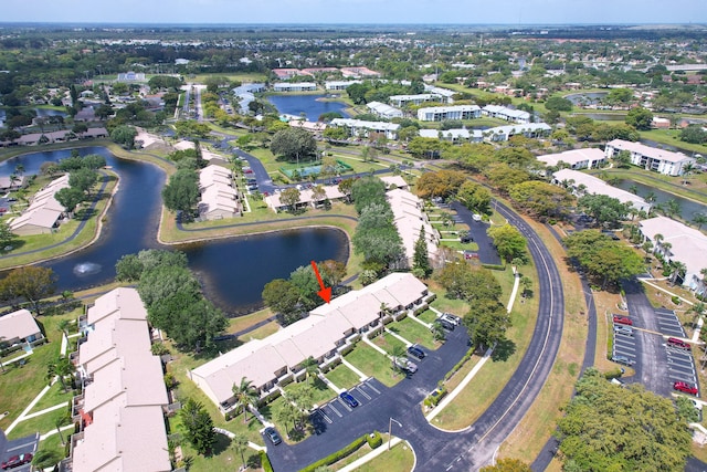 birds eye view of property featuring a water view and a residential view