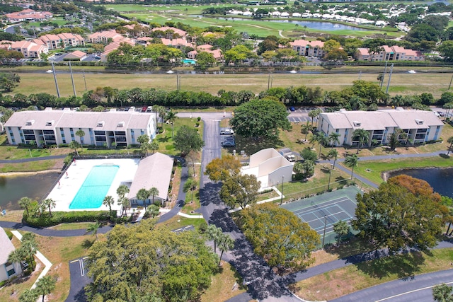 drone / aerial view with a water view and a residential view