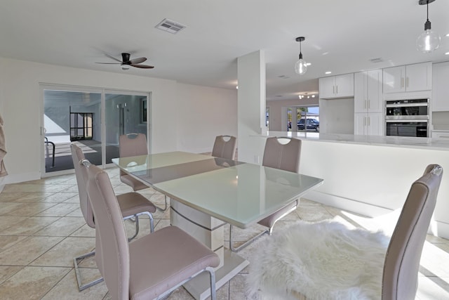 dining area featuring a ceiling fan and visible vents