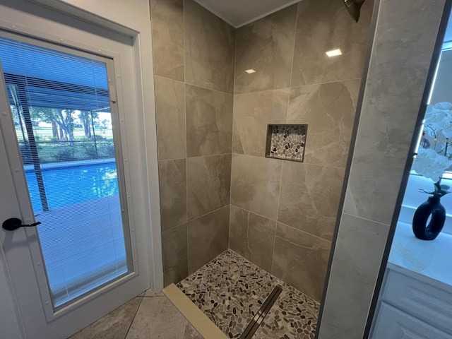 full bath featuring tile patterned flooring and a tile shower