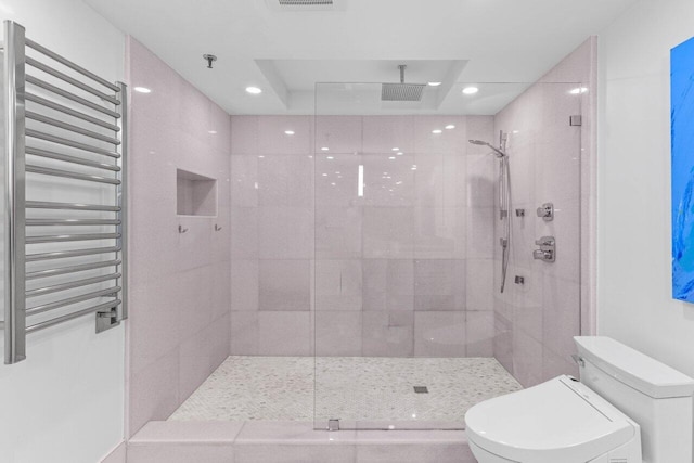 2917 S Ocean Blvd Unit 104, Highland Beach, FL 33487 - full bathroom featuring toilet, recessed lighting, a stall shower, and radiator heating unit