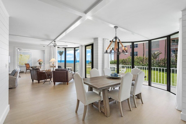 2917 S Ocean Blvd Unit 104, Highland Beach, FL 33487 - dining space with a chandelier, a wall of windows, a ceiling fan, light wood-type flooring, and beam ceiling