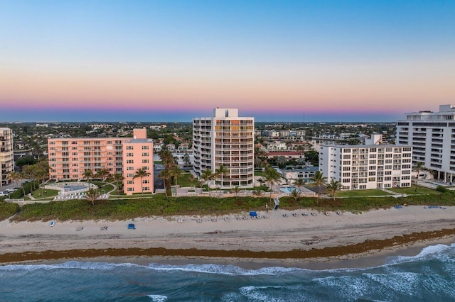 2917 S Ocean Blvd Unit 104, Highland Beach, FL 33487 - aerial view at dusk of view of water and beach and a city view