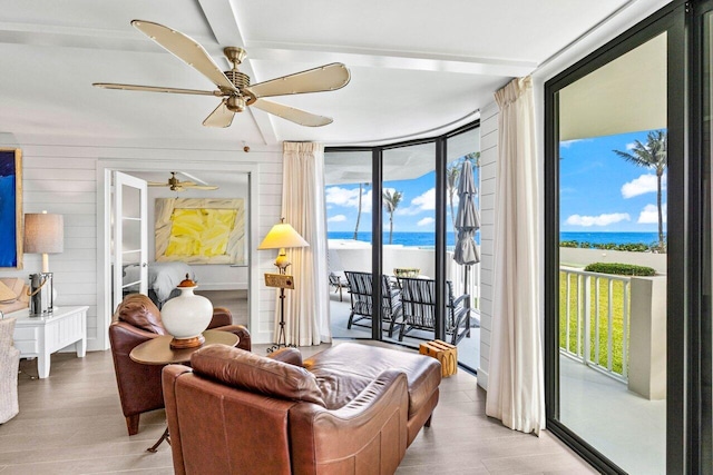 2917 S Ocean Blvd Unit 104, Highland Beach, FL 33487 - living room featuring a wall of windows, plenty of natural light, a water view, and wood finished floors