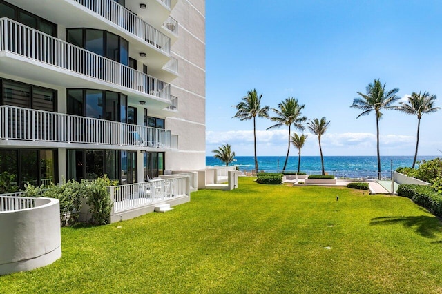 2917 S Ocean Blvd Unit 104, Highland Beach, FL 33487 - surrounding community featuring a water view and a lawn