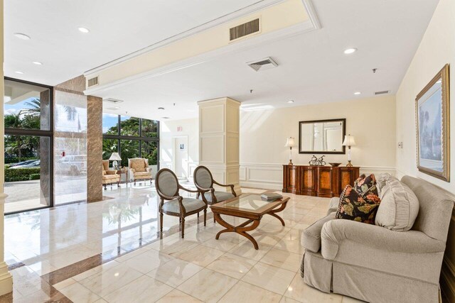2917 S Ocean Blvd Unit 104, Highland Beach, FL 33487 - common area with a decorative wall, wainscoting, expansive windows, and recessed lighting