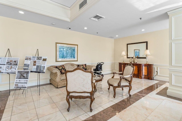 2917 S Ocean Blvd Unit 104, Highland Beach, FL 33487 - living room featuring a decorative wall, wainscoting, light marble finish floors, and recessed lighting