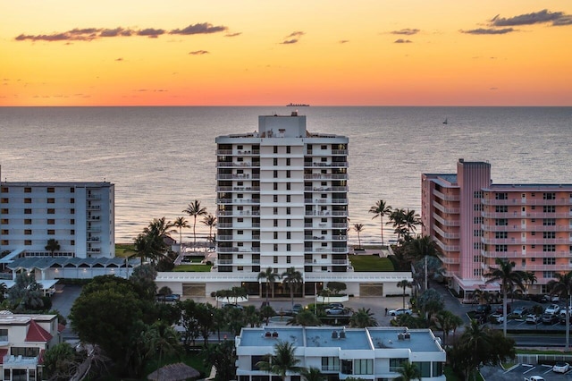 2917 S Ocean Blvd Unit 104, Highland Beach, FL 33487 - property at dusk featuring a water view and a view of apartment building / complex