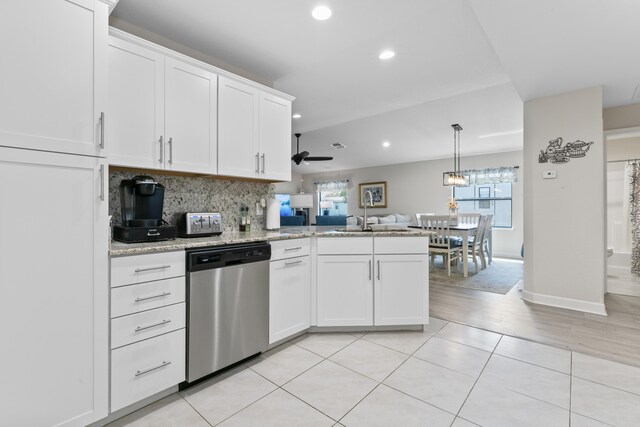 14423 Dalia Ave, Fort Pierce, FL 34951 - kitchen with a peninsula, stainless steel dishwasher, a sink, and plenty of natural light