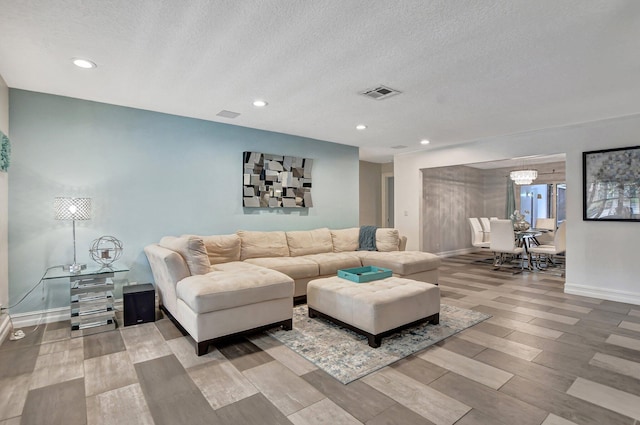 2416 NW 32nd St, Boca Raton, FL 33431 - living room with a textured ceiling, wood finished floors, a chandelier, baseboards, and recessed lighting
