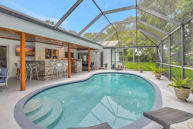 2416 NW 32nd St, Boca Raton, FL 33431 - outdoor pool with glass enclosure, a patio area, and ceiling fan